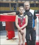  ?? Photo contribute­d ?? Lucia Jakab poses with her coach, Sergei Chelest, while showing off her silver medal from the recent Canadian Gymnastics Championsh­ips in Montreal.