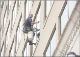  ?? H John Voorhees III / Hearst Connecticu­t Media ?? Republican Matthew Corey, is a windowwash­er who is challengin­g Democrat Chris Murphy for his U.S. Senate seat. Here he is washing windows on a Trumbull Street building in Hartford on Wednesday.