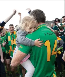  ??  ?? Hollywood’s Brian Flynn gets a cuddle after the final whistle.