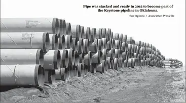  ?? Sue Ogrocki / Associated Press file ?? Pipe was stacked and ready in 2012 to become part of the Keystone pipeline in Oklahoma.