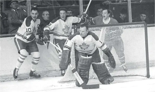  ?? PHOTO BY DENIS BRODEUR / NHLI VIA GETTY IMAGES ?? Goaltender Johnny Bower of the Toronto Maple Leafs stands between the pipes against the Montreal Canadiens in this 1960s- era photo.