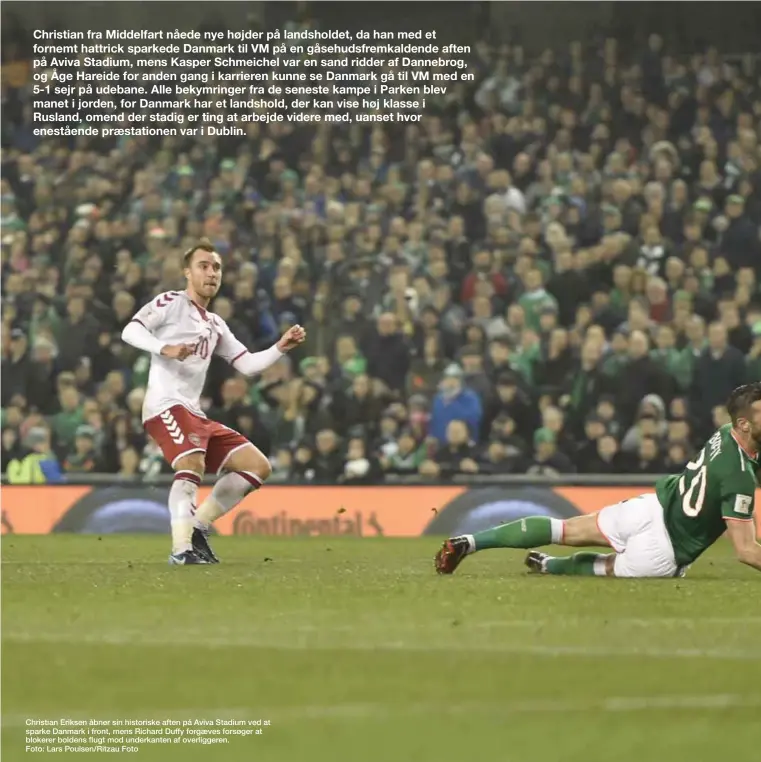  ??  ?? Christian Eriksen åbner sin historiske aften på Aviva Stadium ved at sparke Danmark i front, mens Richard Duffy forgæves forsøger at blokerer boldens flugt mod underkante­n af overligger­en.
Foto: Lars Poulsen/Ritzau Foto