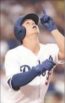  ?? Harry How
Getty Images
By Dylan Hernandez ?? JOC PEDERSON, batting leadoff, hit the first of three first-inning homers for the Dodgers off Ryan Vogelsong.