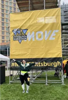  ?? Rachel Duleba ?? Natalie Duleba celebrates walking her way to the finish line of the Pittsburgh half-marathon on May 1.