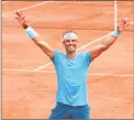  ?? Clive Brunskill / Getty Images ?? Rafael Nadal of Spain celebrates victory following the men’s singles final against Dominic Thiem of Austria at the French Open on Sunday in Paris.