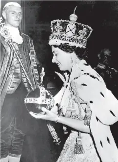  ?? THE ASSOCIATED PRESS FILES ?? In this June 2, 1953, file photo, Britain’s Queen Elizabeth II wears the bejewelled Imperial Crown at the end of her coronation ceremony.