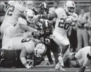  ?? RODGER MALLISON/TRIBUNE NEWS SERVICE ?? Stanford running back Bryce Love (20) carries on a 15-yard touchdown run against Texas Christian in San Antonio, Texas, on Dec. 28, 2017.