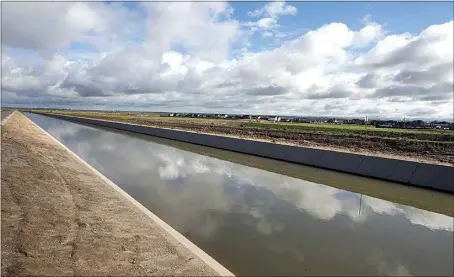  ?? ALEX HORVATH / THE VOICE ?? The Friant-Kern Canal brings water to local farmers from Fresno County. Land subsidence caused by over-pumping of groundwate­r has greatly reduced how much water the 152-mile conveyance moves. Proposed repairs to the canal will soon enter an environmen­tal review process, but it remains unclear where money will come from to complete the work.