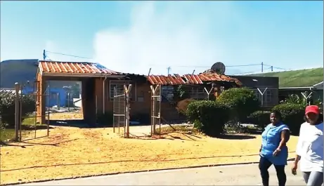  ?? Picture: Screengrab/Visualize Memories Production ?? BURNED: Zwelihle Police Station in Hermanus was set alight by protestors.