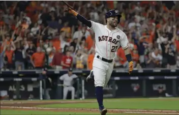  ?? AP PHOTO/DAVID J. PHILLIP ?? Houston Astros’ Jose Altuve celebrates after hitting a home run during the fifth inning of Game 7 of baseball’s American League Championsh­ip Series against the New York Yankees on Saturday in Houston.