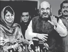  ?? SONU MEHTA/HT ?? Jammu and Kashmir chief minister and J&K Peoples Democratic Party leader Mehbooba Mufti with BJP president Amit Shah and BJP national general secretary Ram Madhav, New Delhi. (File Photo)