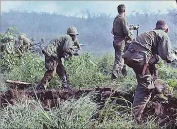  ?? NATIONAL ARCHIVES/AFP US ?? An infantry patrol moves up to assault the last Viet Cong position after an attempted overrun of the artillery position by the Viet Cong during Operation Hawthorne, near Dak To, South Vietnam, on June 7, 1966.