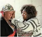  ?? Picture: FREDLIN ADRIAAN ?? IN SHOCK: Grieving mother Ntombebong­o Patricia Kwikwi, 45, and and granny Fezeka Silvia Kwikwi, 65, at home after a devastatin­g fire