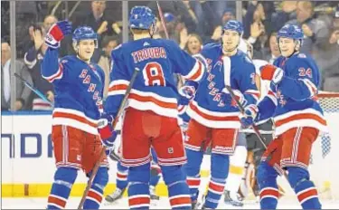  ?? AP ?? Rangers celebrate Jacob Trouba’s goal during first period against Flyers on Wednesday night at Garden.