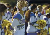  ??  ?? Salinas cheerleade­rs wait for the football game to start against Alvarez at Salinas High School Tuesday.