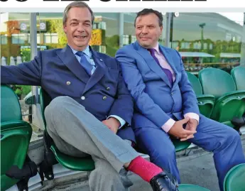  ??  ?? Brexit buddies: Arron Banks with Nigel Farage at Wimbledon in 2016