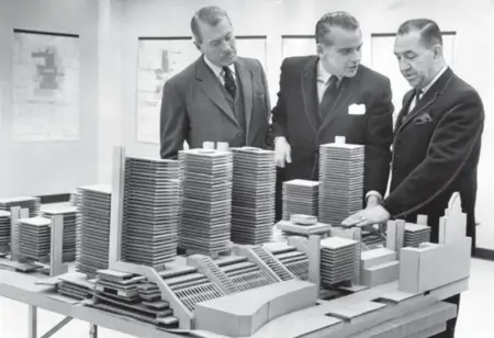  ?? REG INNELL/TORONTO STAR ARCHIVES ?? From left, Metro planning chairman D. Crashley, architect J. C. Parkin and Alderman Fred Beavis study a 1967 model of the proposed transporta­tion centre that would have replaced Union Station with a hotel, convention centre, housing and office towers....