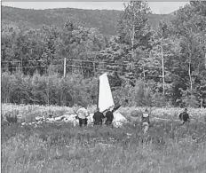  ?? WVII-TV/ABC7 VIA AP ?? This photo provided by WVII-TV/ABC7 shows the tail of a small plane that crashed near Greenville Municipal Airport in Greenville, Maine, Monday, July 30. Police in Maine are investigat­ing the deadly plane crash near a small airport.