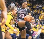  ?? L.G. PATTERSON AP ?? South Carolina's Bree Hall tries to hold on to the ball as Missouri's Ashton Judd defends Thursday night.