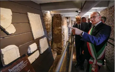  ?? ?? Rome’s Mayor Roberto Gualtieri (right) visits the archaeolog­ical findings of the so-called “Sacred Area” where four temples, dating back as far as the 3rd century B.C., stand smack in the middle of one of modern Rome’s busiest crossroads. (Ap/domenico Stinellis)