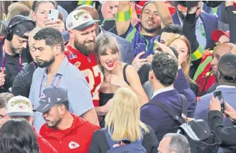  ?? — AFP photo ?? Travis Kelce #87 celebrates with Taylor Swift after defeating the San Francisco 49ers 25-22 in overtime during Super Bowl LVIII at Allegiant Stadium in Las Vegas, Nevada.