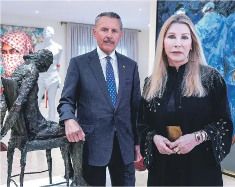  ?? Victor Besa / The National ?? US ambassador John Rakolta and his wife Terry with regional art on the walls of their Abu Dhabi residence