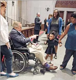  ?? MARK BURNS/AP ?? Former President George H. W. Bush interacts with mourners alongside his daughter Dorothy Bush Koch, left, during visitation Friday at St. Martin's Episcopal Church in Houston.