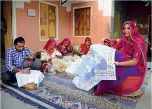  ??  ?? HAND MADE Ruma Devi with the GVCS artisans