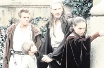  ?? KEITH HAMSHERE Lucasfilm Ltd./Zuma Press/TNS ?? From left, Ewan McGregor, Jake Lloyd, Liam Neeson and Natalie Portman in “Star Wars: Episode I: The Phantom Menace.”