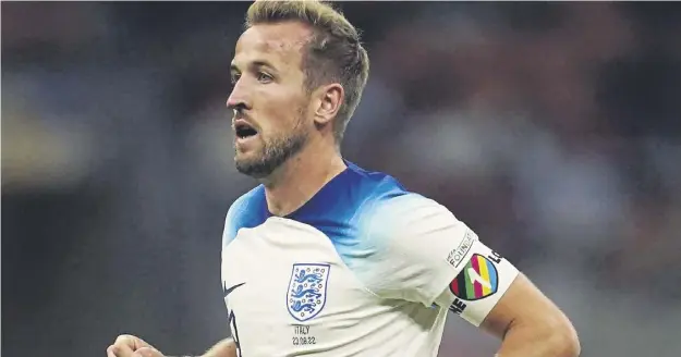  ?? ?? ↑ England skipper Harry Kane wearing the armband during a pretournam­ent match. BBC presenters, including Alex Scott, wore the armband during coverage. Fifa president Gianni Infantino, left, at England’s game against Iran