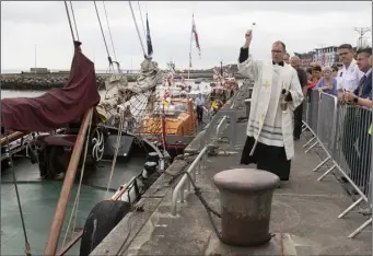  ??  ?? Fr James Cullen blessing the boats at Wexford Quayfront earlier this year.