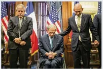  ?? JAY JANNER / AMERICAN-STATESMAN ?? Gov. Greg Abbott prays during a discussion about gun violence in schools at the Governor’s Reception Room at the Capitol on Thursday.