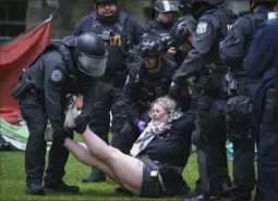  ?? Jessica Griffin/The Philadelph­ia Inquirer via AP ?? Police remove a protester on the University of Pennsylvan­ia campus on May 10.