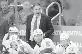  ?? PAUL SANCYA /AP ?? Panthers interim head coach Andrew Brunette watches during Friday’s game against the Red Wings in Detroit.