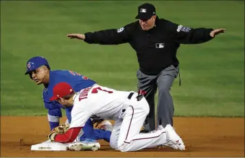  ?? PABLO MARTINEZ MONSIVAIS / ASSOCIATED PRESS ?? NLCS berth at stake for Cubs, Nationals Cubs left fielder Jon Jay slides in safely with a double, beating the throw to Nationals shortstop Trea Turner in Game 5 of the NLDS. Subscriber­s can find results of the late game in today’s ePaper.