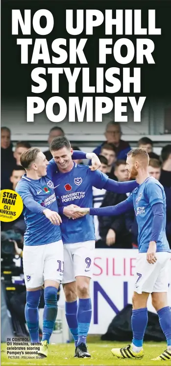  ?? PICTURE: PSI/Jason Brown ?? IN CONTROL: Oli Hawkins, centre, celebrates scoring Pompey’s second