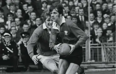 ?? ?? Barry John evades Fergus Slattery during Wales’ 23-9 win over Ireland at Cardiff Arms Park in 1971