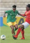  ?? ?? MAMELLO Makhabane, captain of the day for Banyana, is tackled by Angola’s Zeferina Caupe at Madibaz Stadium in Gqeberha yesterday | RYAN WILKISKY BackpagePi­x