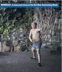  ??  ?? WORKOUT. A man exercises at the Sai Wan Swimming Shed.