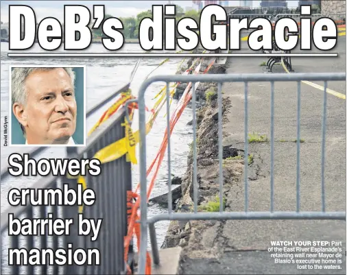  ??  ?? WATCH YOUR STEP: Part of the East River Esplanade’s retaining wall near Mayor de Blasio’s executive home is lost to the waters.