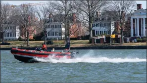  ?? (AP/Jacquelyn Martin) ?? A District of Columbia fire boat worker checks buoys Friday in the waterway next to Fort McNair in Washington. Iran has made threats against the fort and against the Army’s vice chief of staff, according to U.S. intelligen­ce officials.