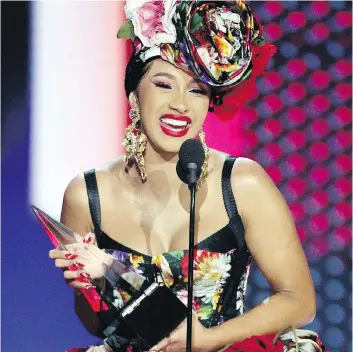  ?? FREDERICK M. BROWN/GETTY IMAGES ?? Cardi B, seen accepting the favourite artist award for rap-hip hop at the American Music Awards on Wednesday, will not be considered a new artist for the 2019 Grammy Awards.