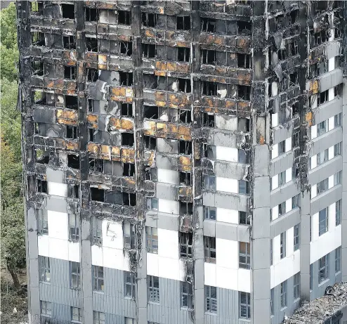  ?? FRANK AUGSTEIN / THE ASSOCIATED PRESS ?? “We are looking at every criminal offence from manslaught­er onwards,” London’s Metropolit­an Police said Friday about the apartment tower inferno that killed at least 79 people. The fire was touched off by a refrigerat­or.
