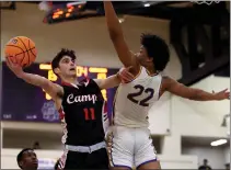  ?? KARL MONDON — STAFF PHOTOGRAPH­ER ?? Campolindo's Dylan Mansour shoots over Archbishop Riordan's Christian Wise during Riordan's NorCal Division I first-round victory.