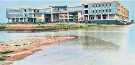  ??  ?? The collectora­te complex constructe­d near the Damarakunt­a lake is inundated due to the poor drainage system in Rajanna Sircilla district.