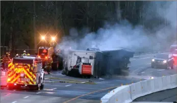  ?? Darrell Sapp/Post-Gazette ?? Fatalities in crashes involving large trucks, like this tractor-trailer that overturned on the Pennsylvan­ia Turnpike, continue to rise.