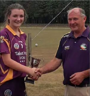  ??  ?? Aoibhe MacSweeney, captain of the ‘A’ team, with Joe Roche, Developmen­t Officer of Wexford Camogie Board,