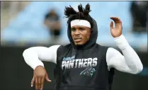  ?? MIKE MCCANN - THE ASSOCIATED PRESS ?? FILE - In this Sept. 12, 2019, file photo, Carolina Panthers quarterbac­k Cam Newton warms up prior to the team’s NFL football game against the Tampa Bay Buccaneers in Charlotte, N.C. The New England Patriots have reached an agreement with free-agent quarterbac­k Newton, bringing in the 2015 NFL Most Valuable Player to help the team move on from three-time MVP Tom Brady, a person with knowledge of the deal told The Associated Press.