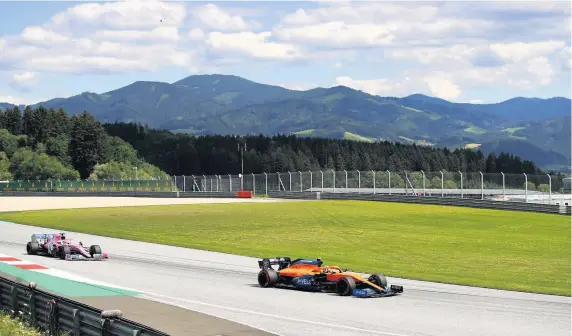  ?? Picture: Bryn Lennon/Getty ?? Lando Norris, right, driving his McLaren car during Sunday’s Styrian Grand Prix