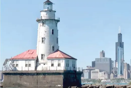  ?? MITCH DUDEK/SUN-TIMES ?? The Chicago Harbor Lighthouse, located a mile out on Lake Michigan.